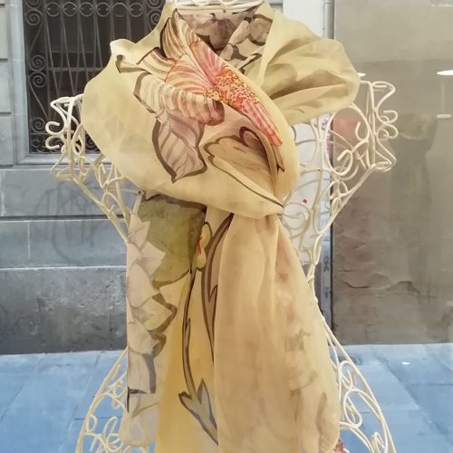 Silk organza scarf. Elegant design with flowes. Yellow pastel colours